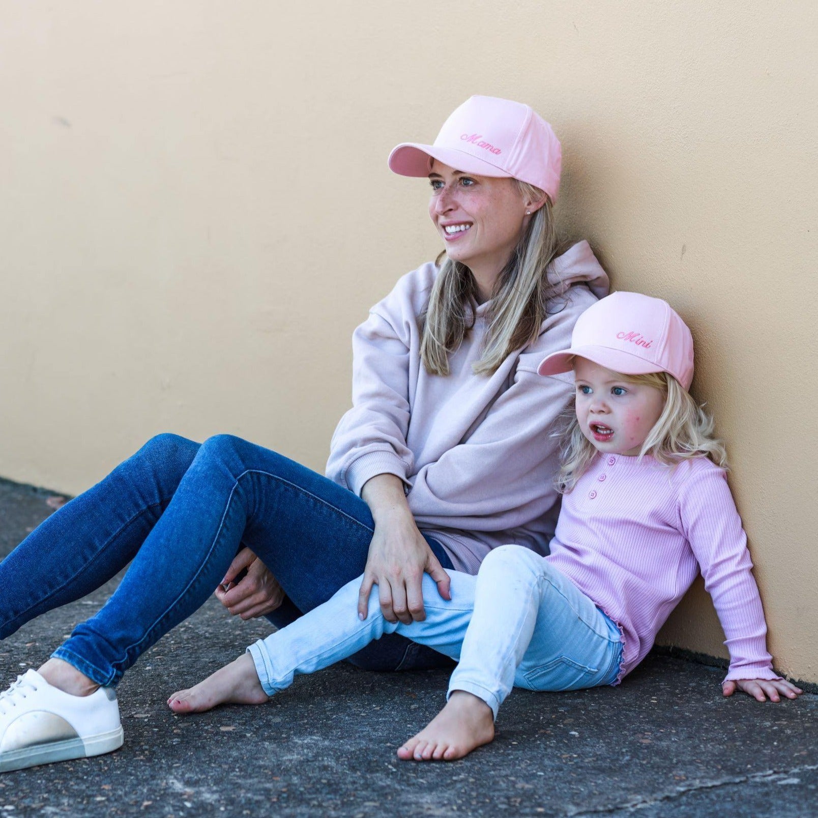 Matching mum and daughter wearing pink baseball caps. Cubs & Co. Australia