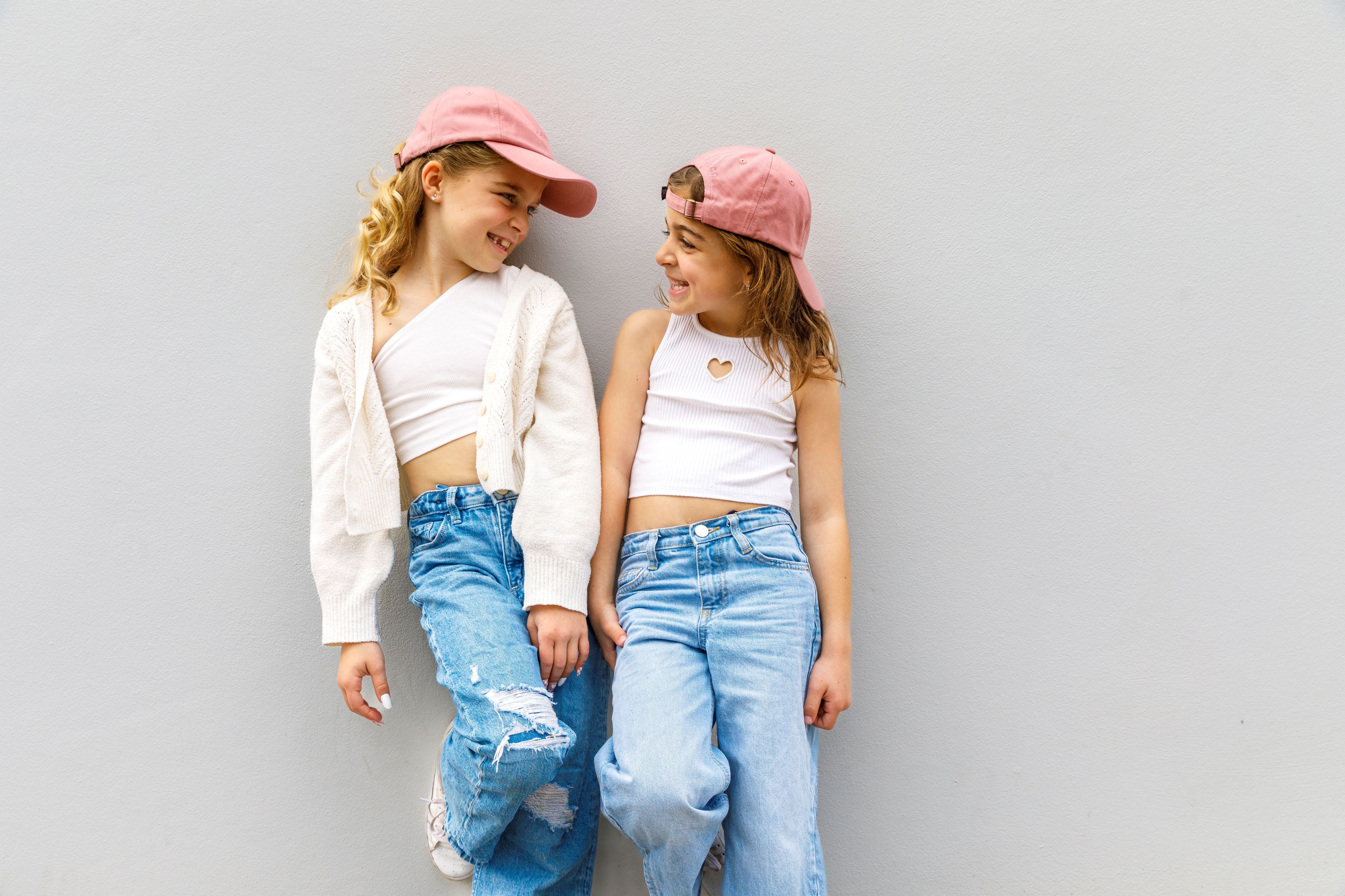 matching oink good vibes caps for sisters
