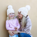 Matching mum and daughter cream winter cotton beanie with pom pom. Cubs & Co. Australia.