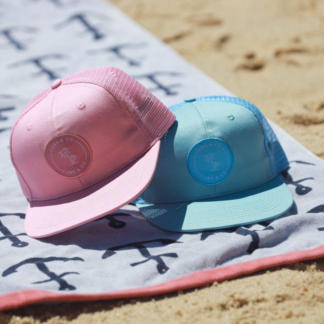 Matching blue and pink trucker hats for babies, toddlers, kids, men and women. Cubs & Co. Australia